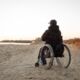 full-shot-disabled-man-beach_23-2148779024.jpg